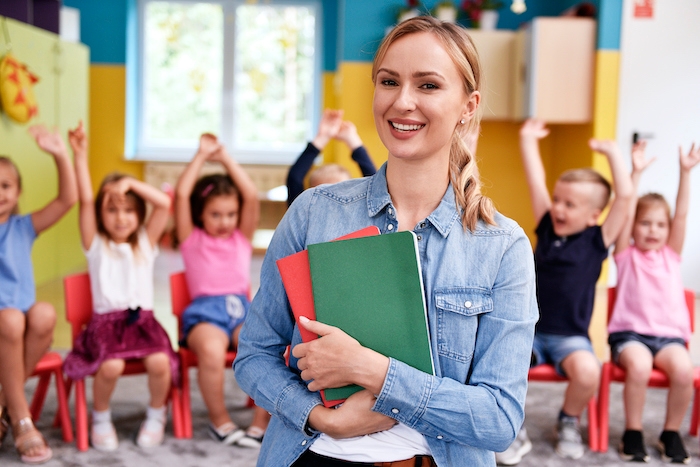 Smiling female teacher in the preschool, Master of Education in Instruction and Learning