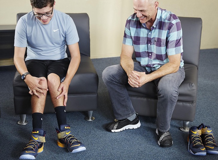 Matthew Walzer (left) wears special Nike sneakers designed by ACU alumnus Tobie Hatfield (right). The footwear system is designed for people with disabilities. (Nike photo)