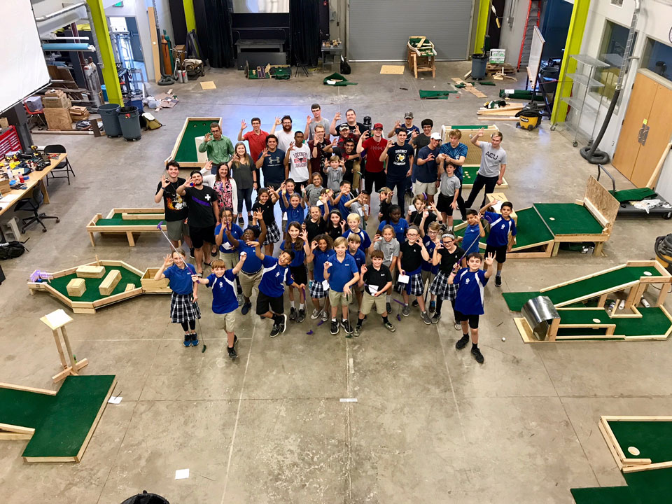 Abilene Christian Schools fifth-graders and ACU freshmen gathered for a photo after the students tested the mini golf course designed by engineering and physics students. 
