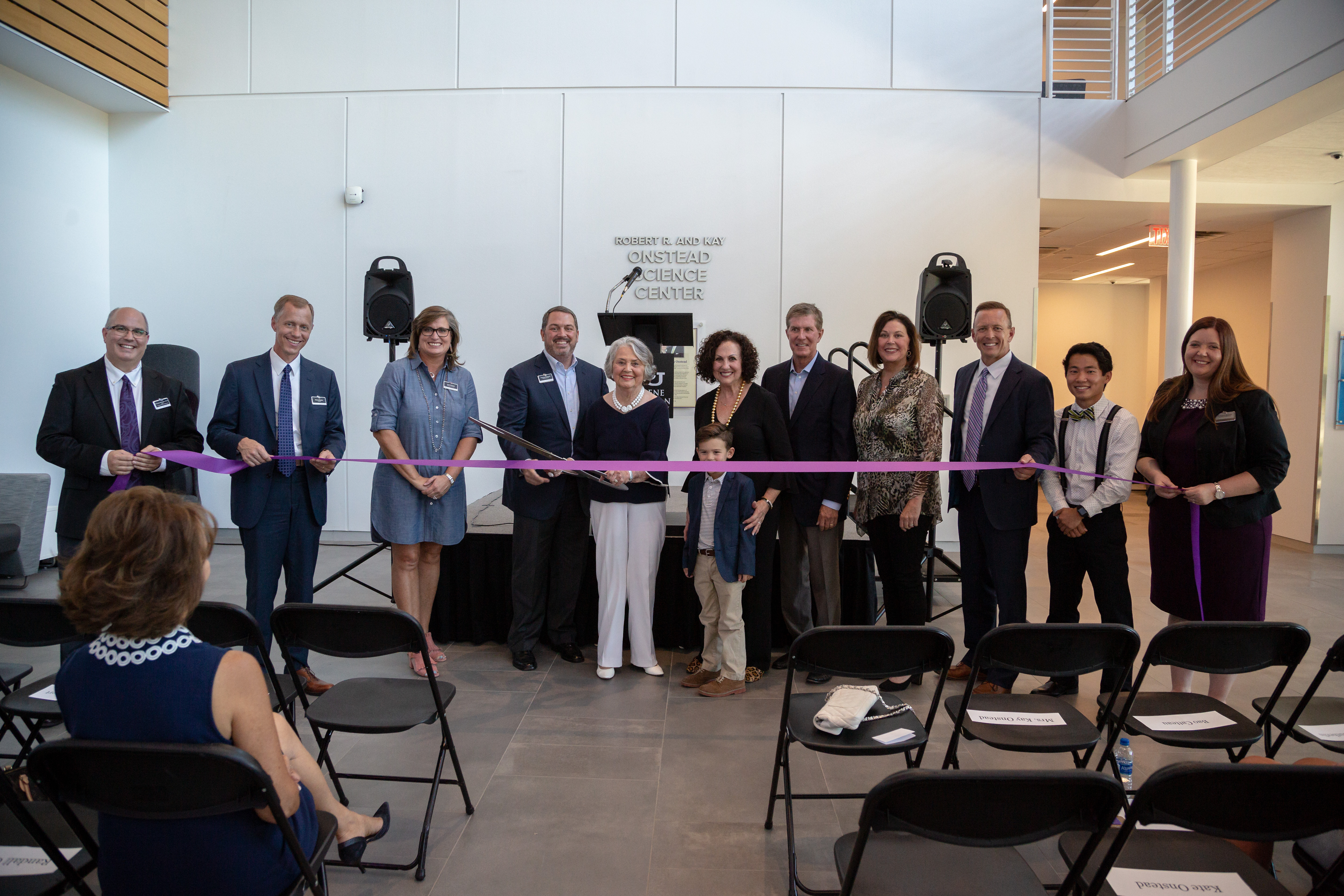 The opening of the Robert R. and Kay Onstead Science Center featured the cutting of a ceremonial ribbon. Pictured from left: Dr. Gregory Straughn, dean of the College of Arts and Sciences; Dr. Robert Rhodes, provost; April Anthony, chair of the Board of Trustees; Charlie Onstead; Kay Onstead; Ann Hill; Randall Onstead; Mary Onstead; Dr. Phil Schubert, president; Bao Catteau, sophomore; and Dr. Autumn Sutherlin, assistant dean of the College of Arts and Sciences.