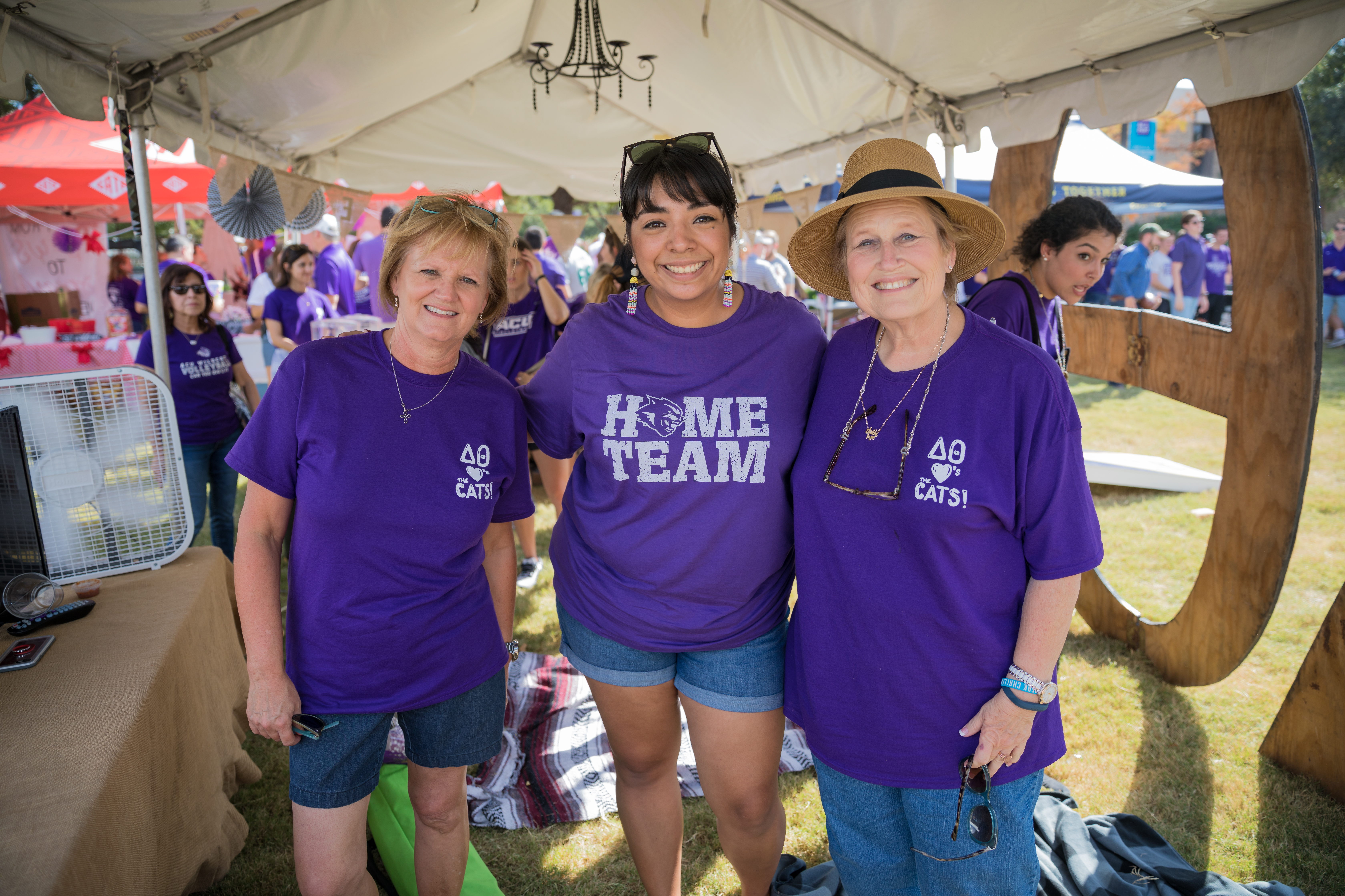 Delta Theta sponsors (from left) Beth (Neeley '78) Peables, Emerald (Cardenas '08) Cassidy and Debbie Haag ('73)are ready to welcome guests to the club's tent.