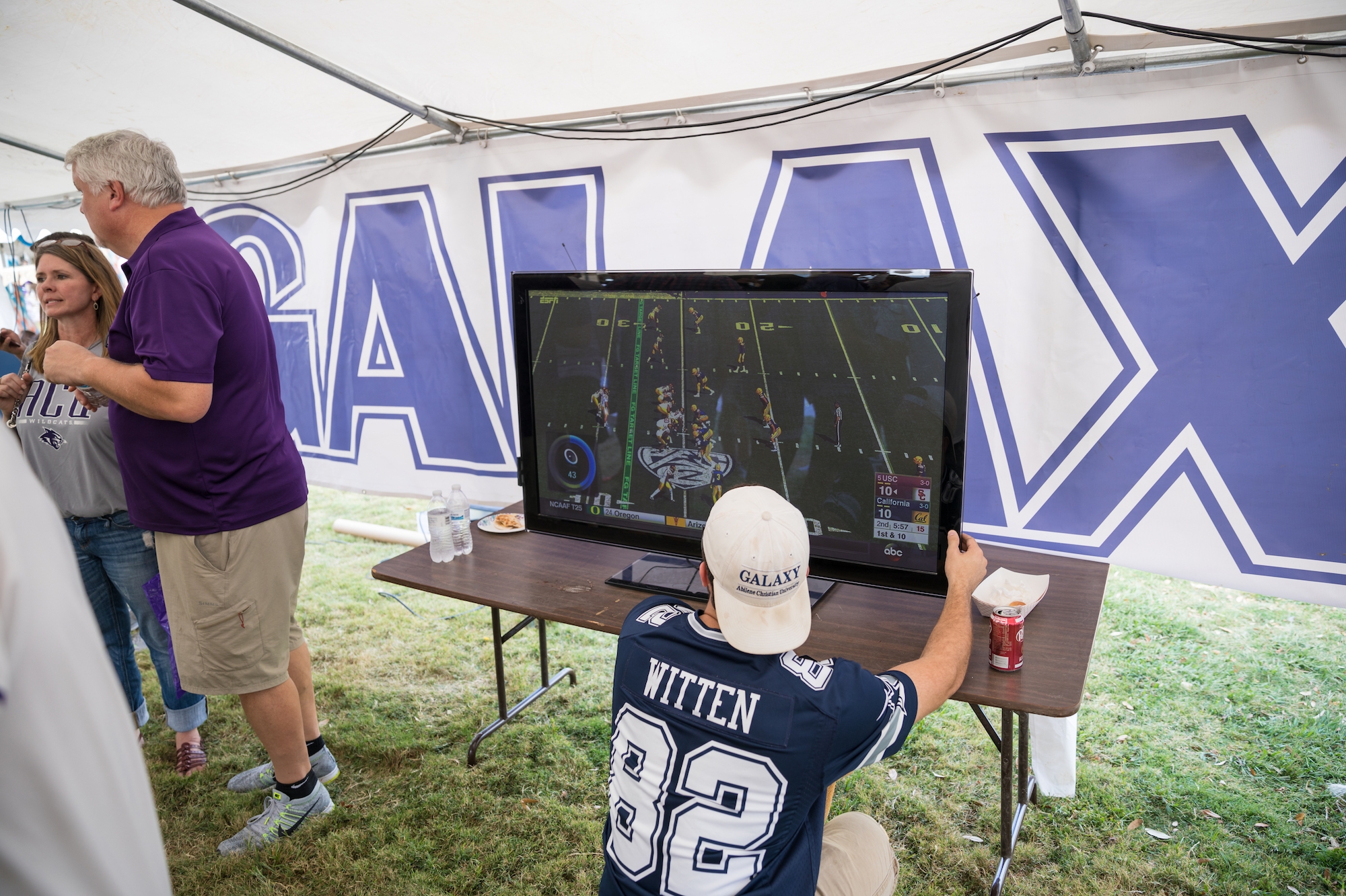 Galaxy members set up a big screen to monitor the action during their tailgate.