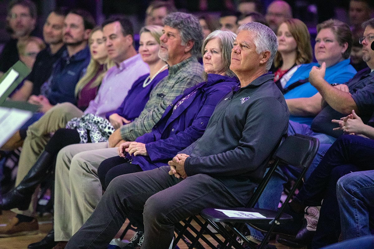 Doug and Angie Robison listen during Homecoming Chapel on Saturday, Oct. 13, 2018. Next to them are Doug's brother, Dan, and his wife, Pam. The Robison family are members of the Robison Excelsior Foundation, which has pledged $3.2 million to ACU's NEXT Lab. 