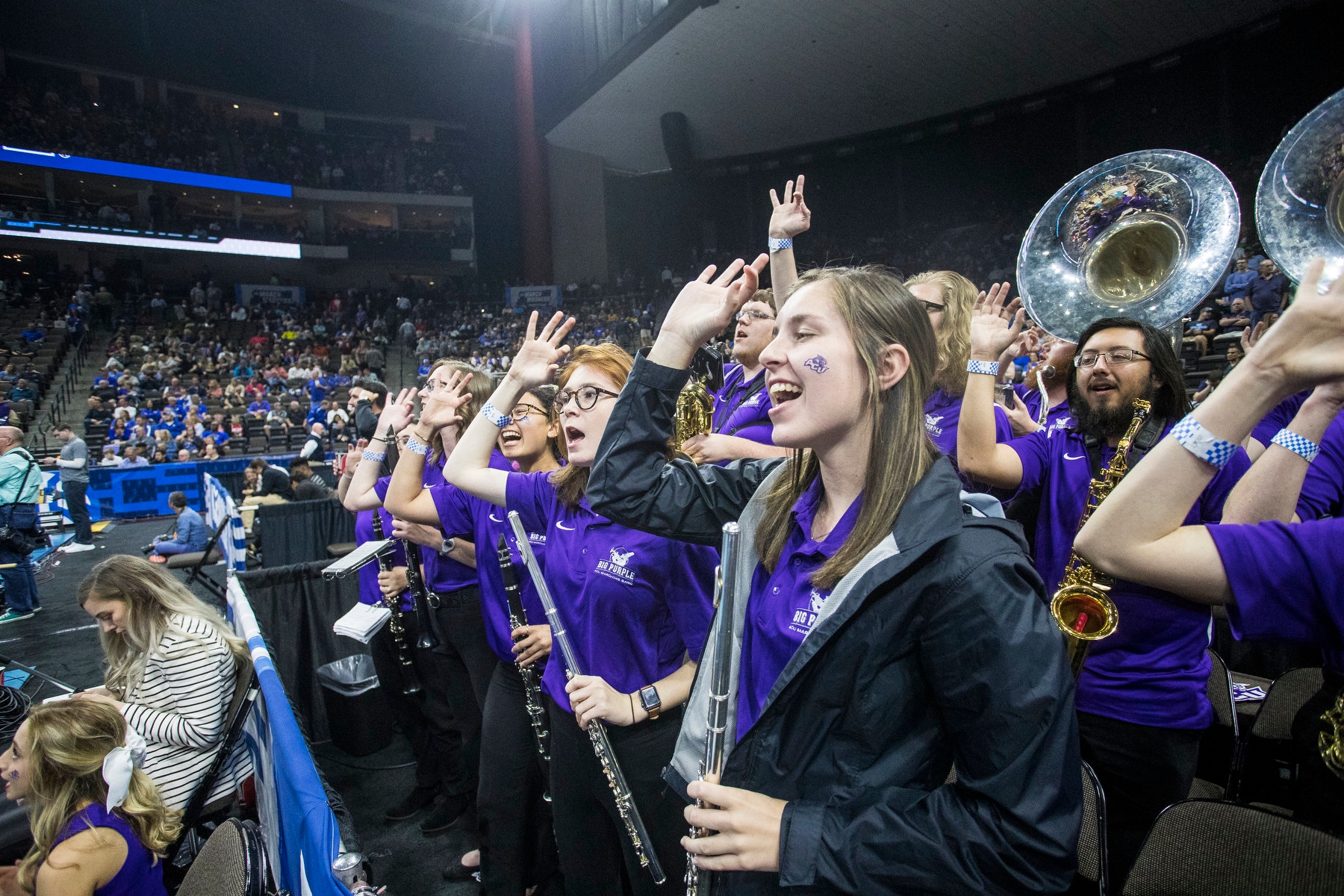 Between tunes, Big Purple basketball band members show their school spirit during Thursday night’s ACU-Kentucky game in Jacksonville. 