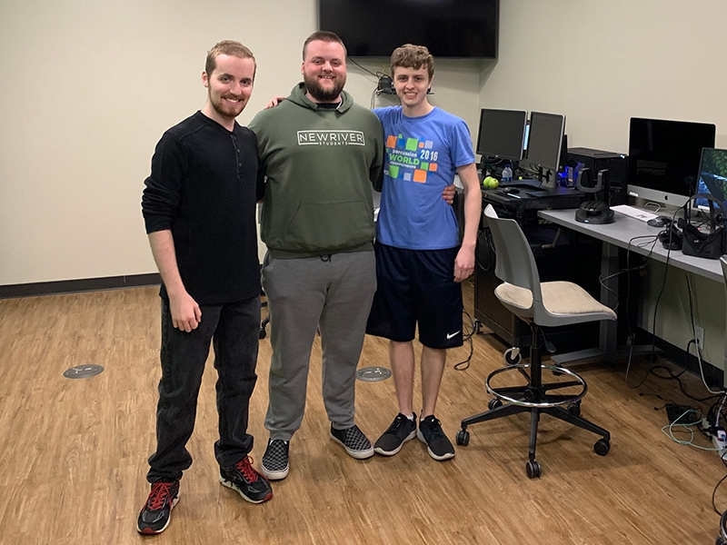 From left are game designers Andrew Thomas, Caleb Jackson and Bryce Gattis.