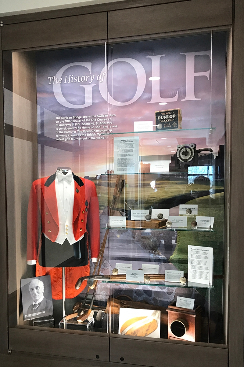 Another clubhouse display provides insights into golf history through artifacts, including the Captain’s Jacket belonging to Sir John Simon in 1937. Simon captained the Royal & Ancient Golf Club in Scotland, the home of golf, and was a leader in Great Britain’s government during World War I.
