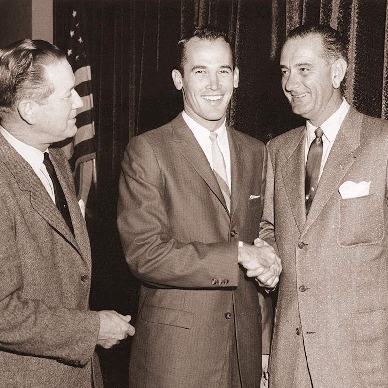 Texas Sen. Omar Burleson (left) watches as Bobby Morrow shakes hands with Texas governor Lyndon B. Johnson, who went on to become the 36th president of the U.S. Burleson was a 1928 ACU graduate.