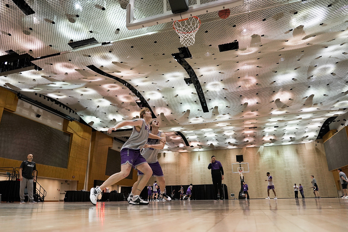Freshman forward Jameson Richardson and junior forward Clay Gayman battle for position on the Wildcats’ practice court in the Indiana Convention Center in Indianapolis.